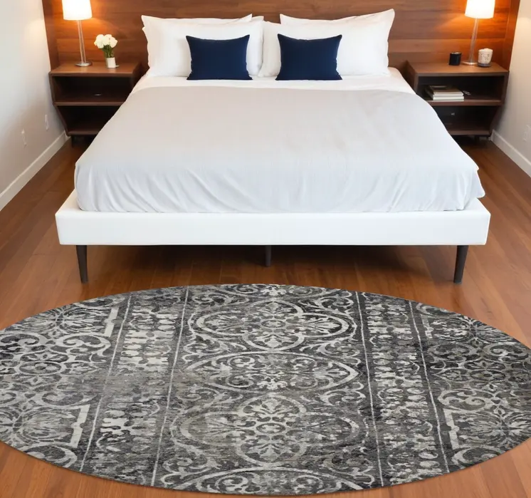 9' Black and Ivory Round Abstract Area Rug