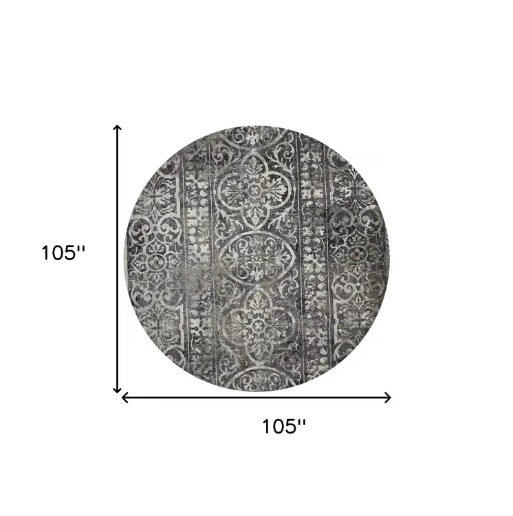 9' Black and Ivory Round Abstract Area Rug