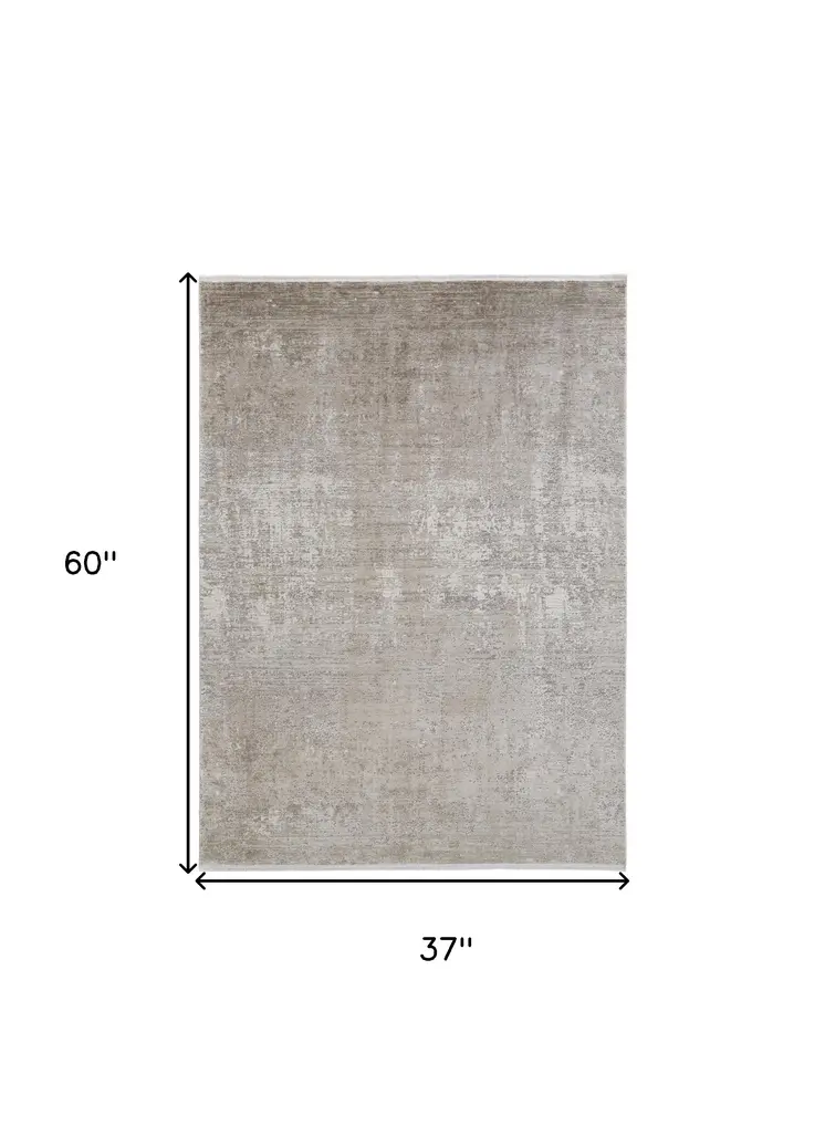 3' X 5' Tan and Ivory Abstract Power Loom Distressed Area Rug With Fringe