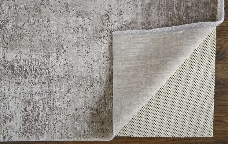 3' X 5' Tan and Ivory Abstract Power Loom Distressed Area Rug With Fringe