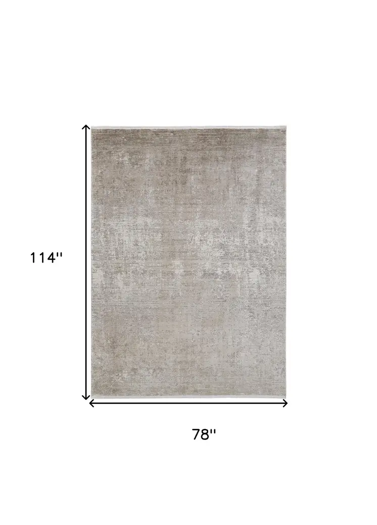 7' X 10' Tan and Ivory Abstract Power Loom Distressed Area Rug With Fringe