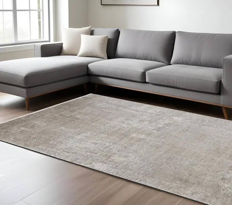 7' X 10' Tan and Ivory Abstract Power Loom Distressed Area Rug With Fringe