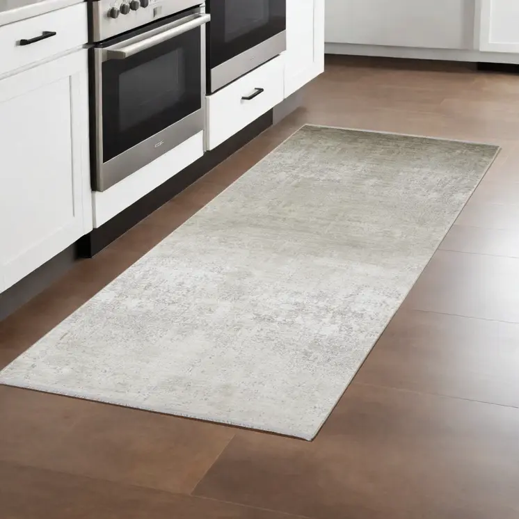 10' Tan and Ivory Abstract Power Loom Distressed Runner Rug With Fringe