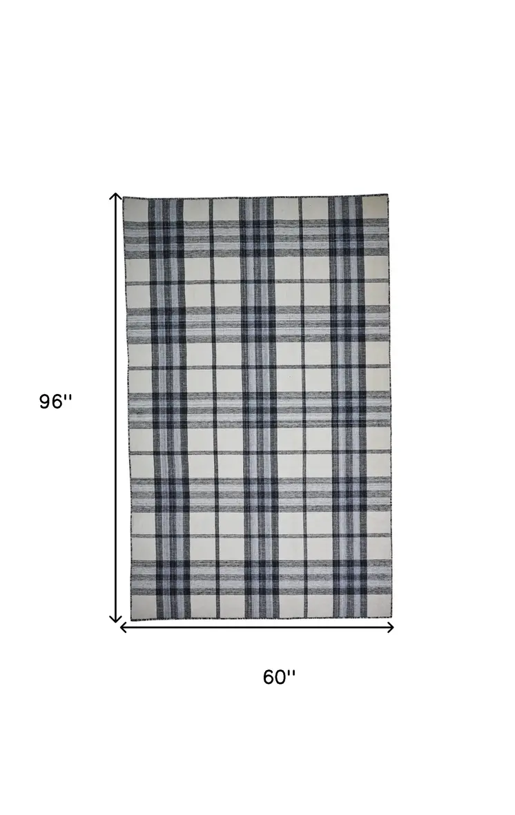 5' X 8' Ivory Blue And Black Abstract Hand Woven Stain Resistant Area Rug