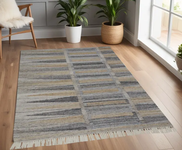 4' X 6' Tan and Gray Geometric Hand Woven Area Rug With Fringe