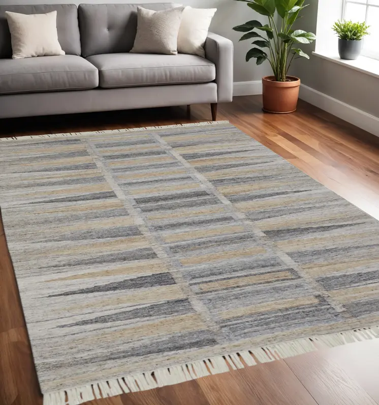 5' X 8' Tan Gray And Taupe Geometric Hand Woven Stain Resistant Area Rug With Fringe