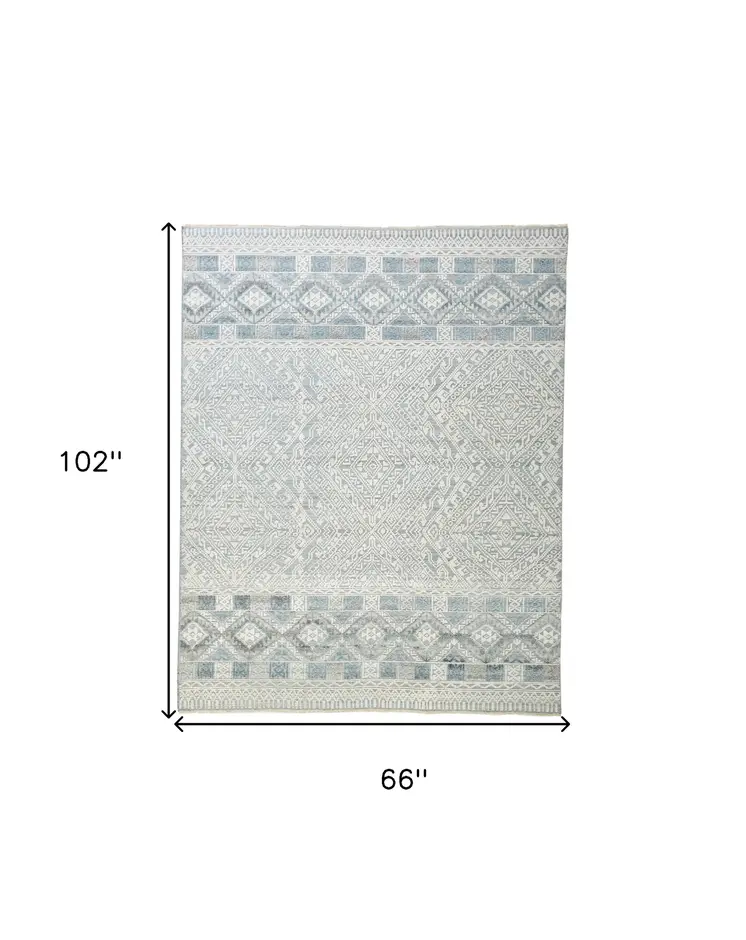 5' X 8' Ivory and Blue Geometric Hand Knotted Area Rug