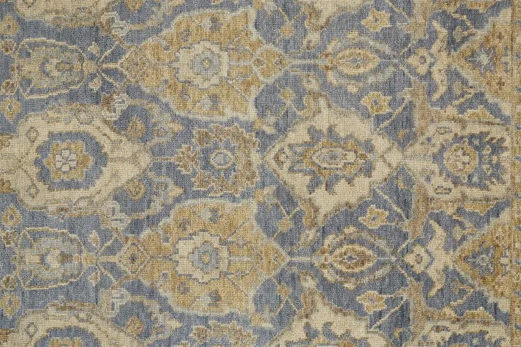 8' X 10' Blue Gold And Tan Wool Floral Hand Knotted Stain Resistant Area Rug With Fringe