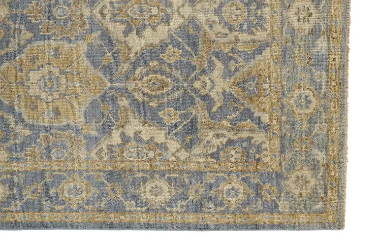 8' X 10' Blue Gold And Tan Wool Floral Hand Knotted Stain Resistant Area Rug With Fringe