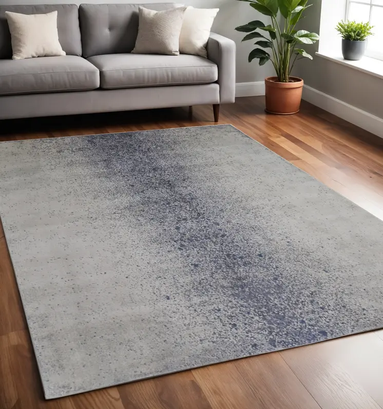 5' X 8' Ivory and Blue Abstract Power Loom Non Skid Area Rug