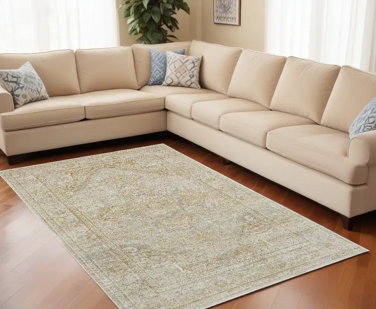 10' X 13' Ivory And Gold Floral Stain Resistant Area Rug