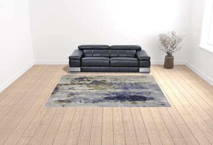 9' X 12' Blue Orange And Ivory Abstract Power Loom Area Rug