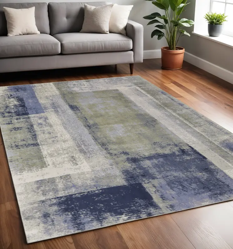 5' X 8' Blue and Ivory Abstract Power Loom Distressed Area Rug