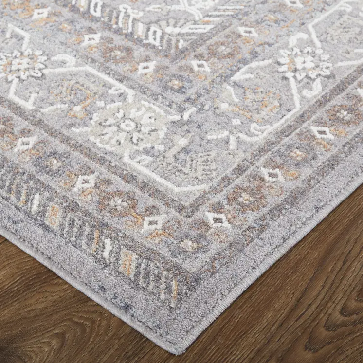 10' X 13' Gray Orange And Ivory Floral Power Loom Stain Resistant Area Rug