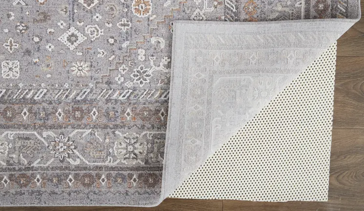 10' X 13' Gray Orange And Ivory Floral Power Loom Stain Resistant Area Rug