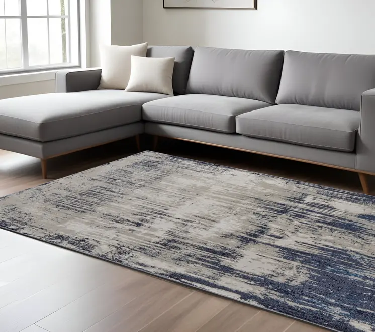 7' X 10' Tan Blue And Ivory Abstract Power Loom Distressed Area Rug