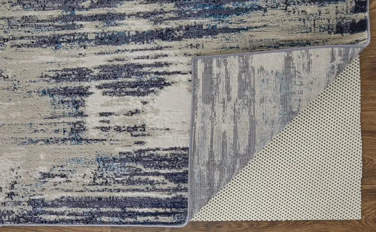 7' X 10' Tan Blue And Ivory Abstract Power Loom Distressed Area Rug