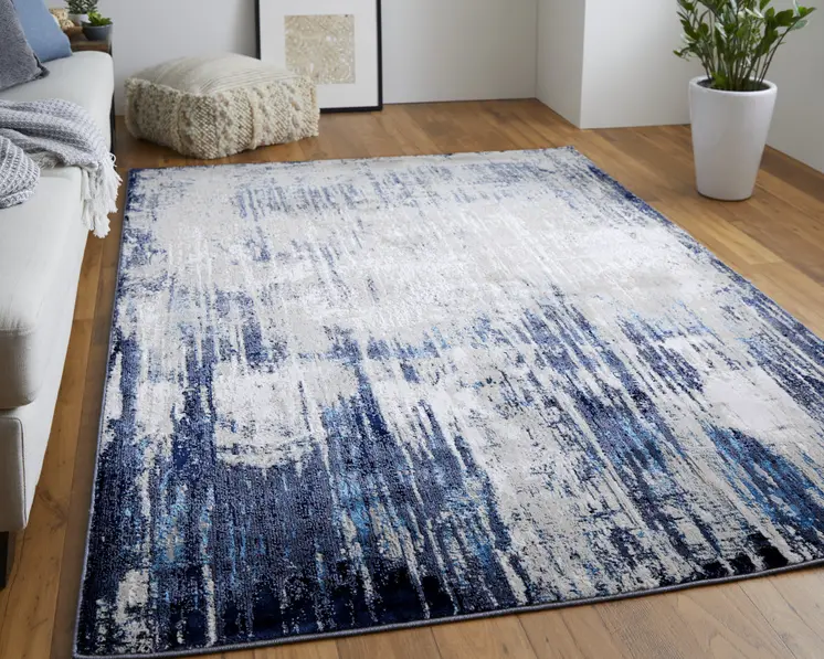 10' X 13' Tan Blue And Ivory Abstract Power Loom Distressed Area Rug