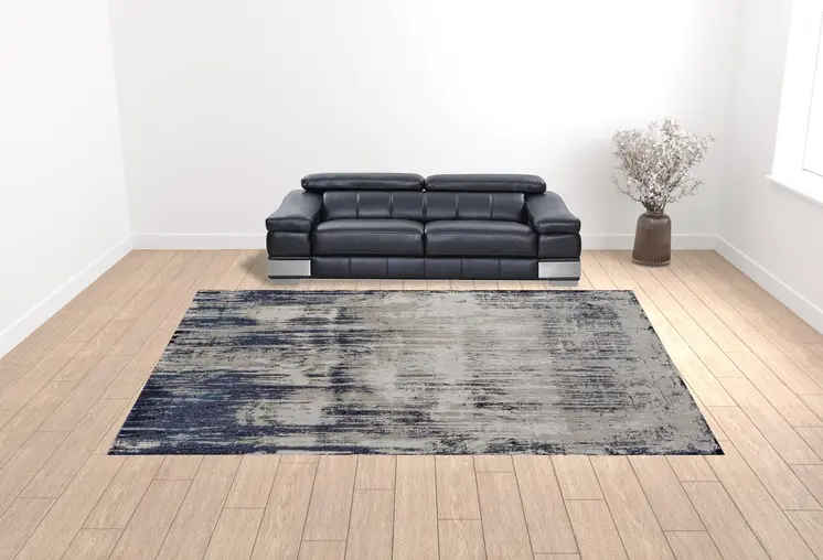 12' X 15' Tan Blue And Ivory Abstract Power Loom Distressed Area Rug
