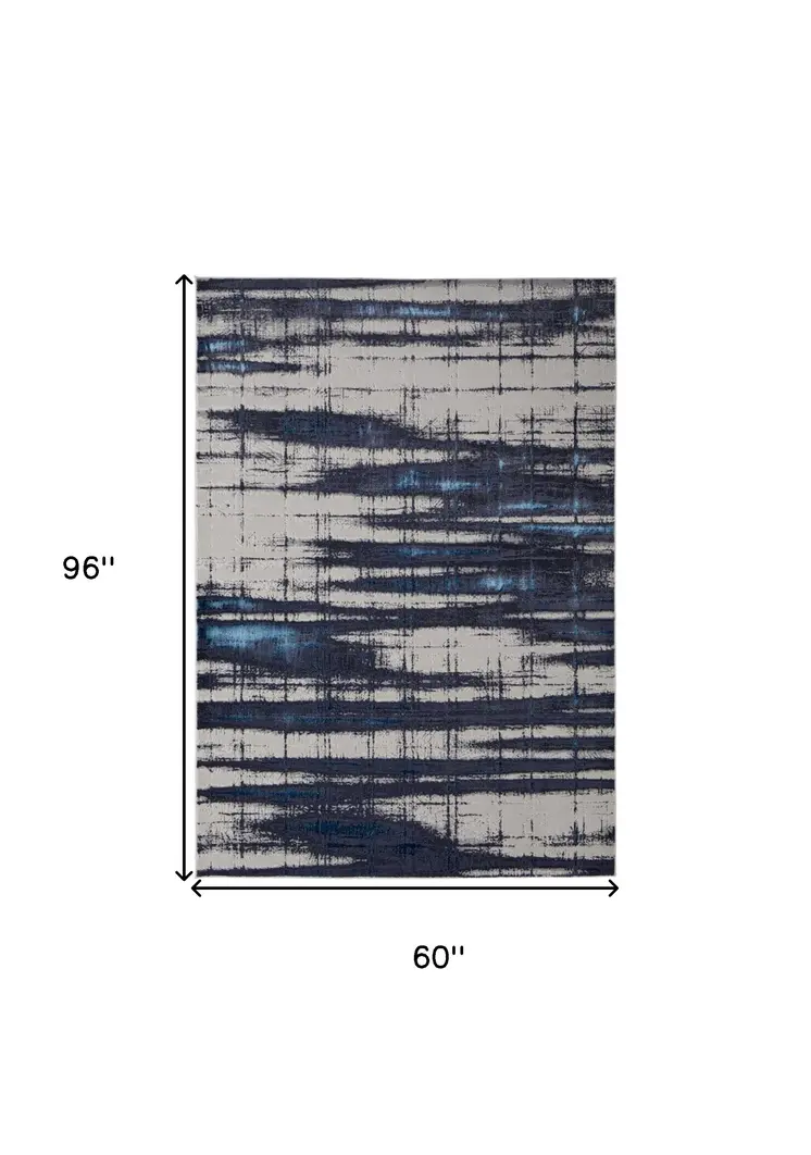 5' X 8' Ivory and Blue Abstract Power Loom Distressed Non Skid Area Rug