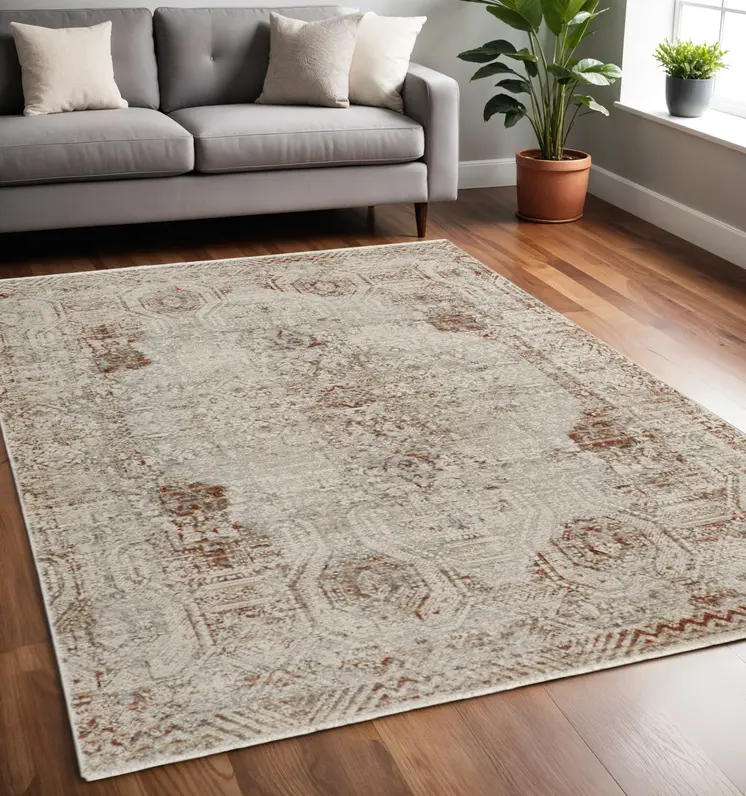 5' X 8' Gray Ivory And Burnt Orange Oriental Distressed Area Rug With Fringe