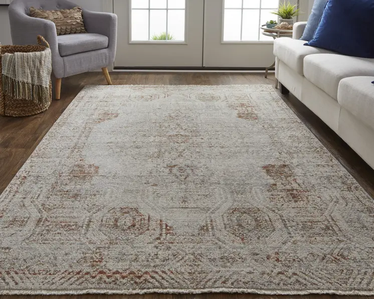 8' X 10' Tan and Ivory Floral Power Loom Distressed Non Skid Area Rug With Fringe
