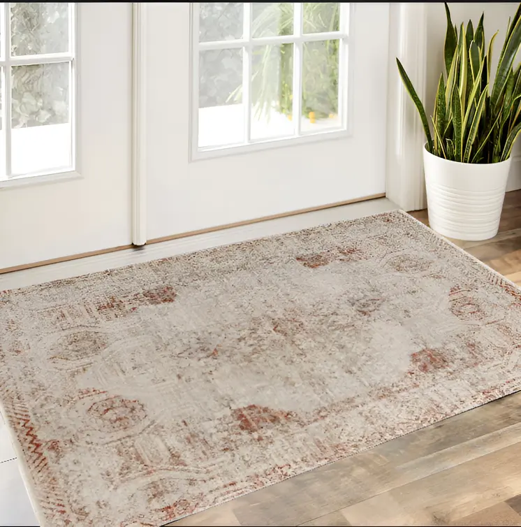 2' X 3' Tan Ivory And Orange Floral Power Loom Distressed Area Rug With Fringe