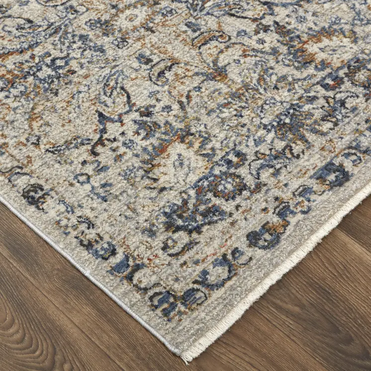 8' X 10' Tan and Blue Floral Power Loom Distressed Non Skid Area Rug With Fringe