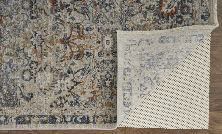8' X 10' Tan and Blue Floral Power Loom Distressed Non Skid Area Rug With Fringe
