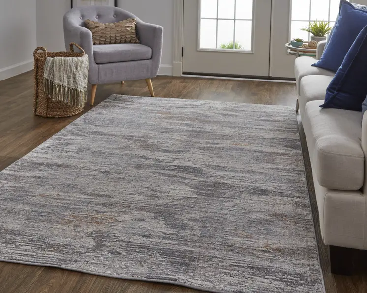 5' X 8' Taupe Tan and Orange Abstract Power Loom Distressed Area Rug