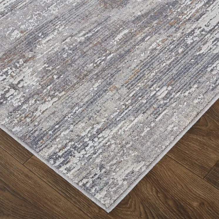 5' X 8' Taupe Tan and Orange Abstract Power Loom Distressed Area Rug
