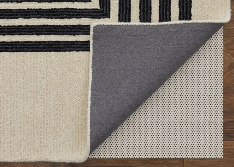 5' X 8' Black and Ivory Abstract Geometric Hand Tufted Area Rug
