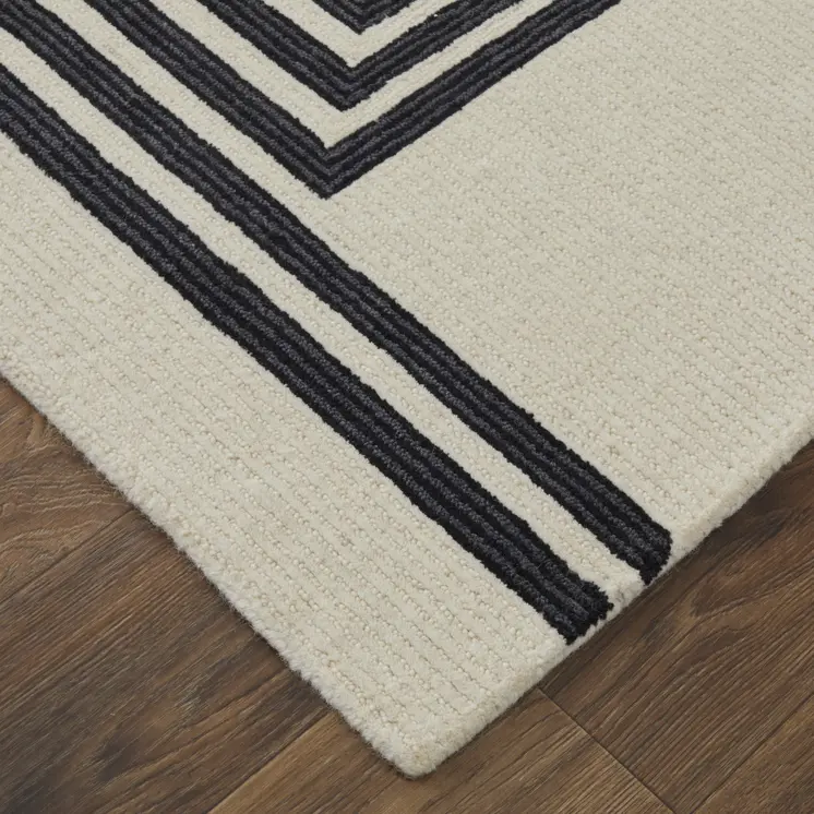 5' X 8' Black and Ivory Abstract Geometric Hand Tufted Area Rug