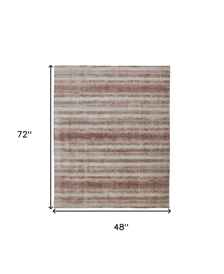 4' X 6' Tan and Ivory Abstract Hand Woven Area Rug