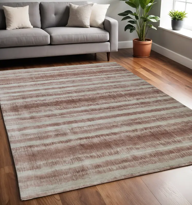 5' X 8' Tan and Ivory Abstract Hand Woven Area Rug
