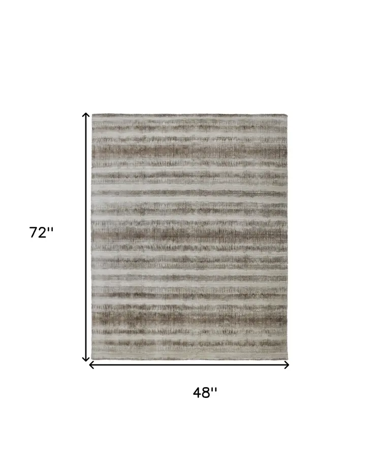 4' X 6' Tan and Ivory Abstract Hand Woven Area Rug