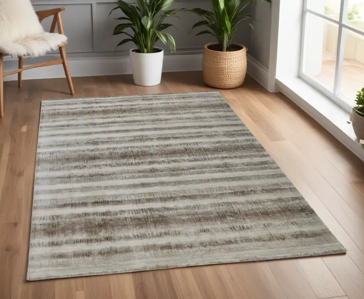 4' X 6' Tan and Ivory Abstract Hand Woven Area Rug