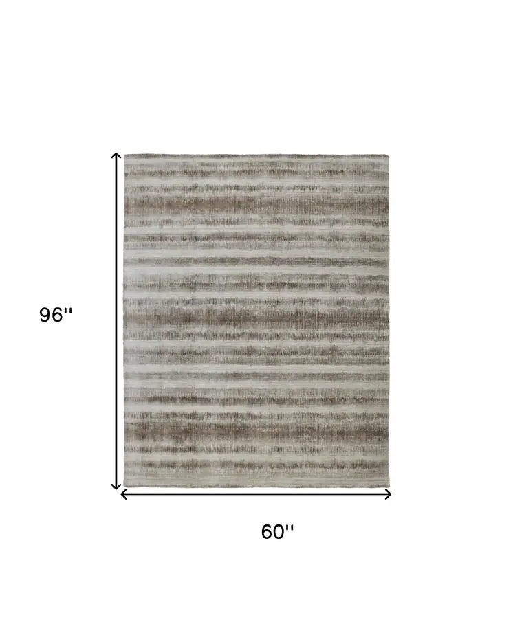5' X 8' Tan and Ivory Abstract Hand Woven Area Rug