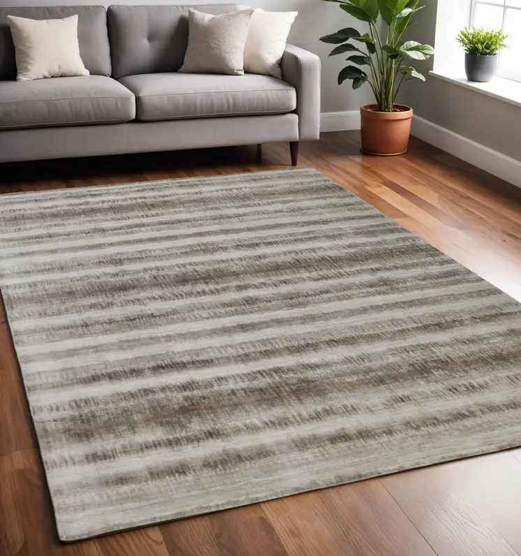5' X 8' Tan and Ivory Abstract Hand Woven Area Rug
