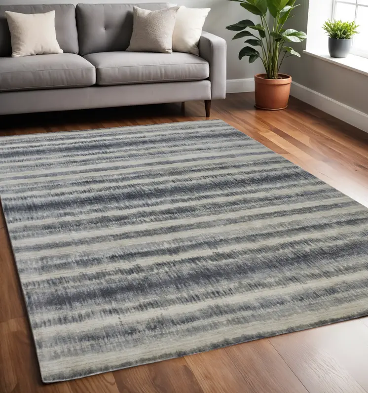 5' X 8' Ivory And Blue Abstract Hand Woven Area Rug