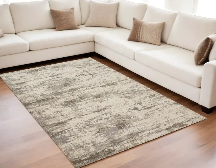 5' X 8' Ivory And Brown Abstract Area Rug