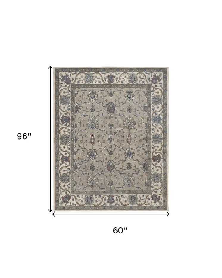 5' X 8' Ivory and Blue Wool Floral Hand Tufted Area Rug