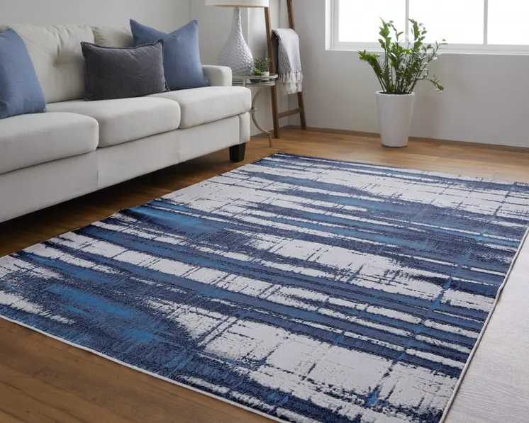 2' X 3' Ivory Blue And Gray Abstract Power Loom Distressed Area Rug