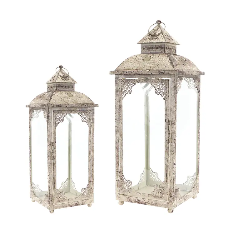 Set of Two Beige Distressed Ornate Glass And Metal Floor Lantern Candle Holders