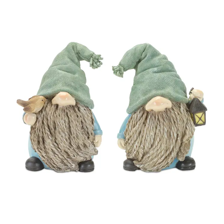 Set of Four Blue and Green Polyresin Christmas Figurine Tabletop Sculpture