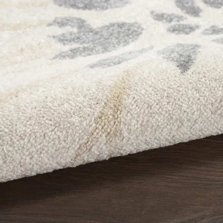 5' X 7' Cream Floral Power Loom Distressed Area Rug