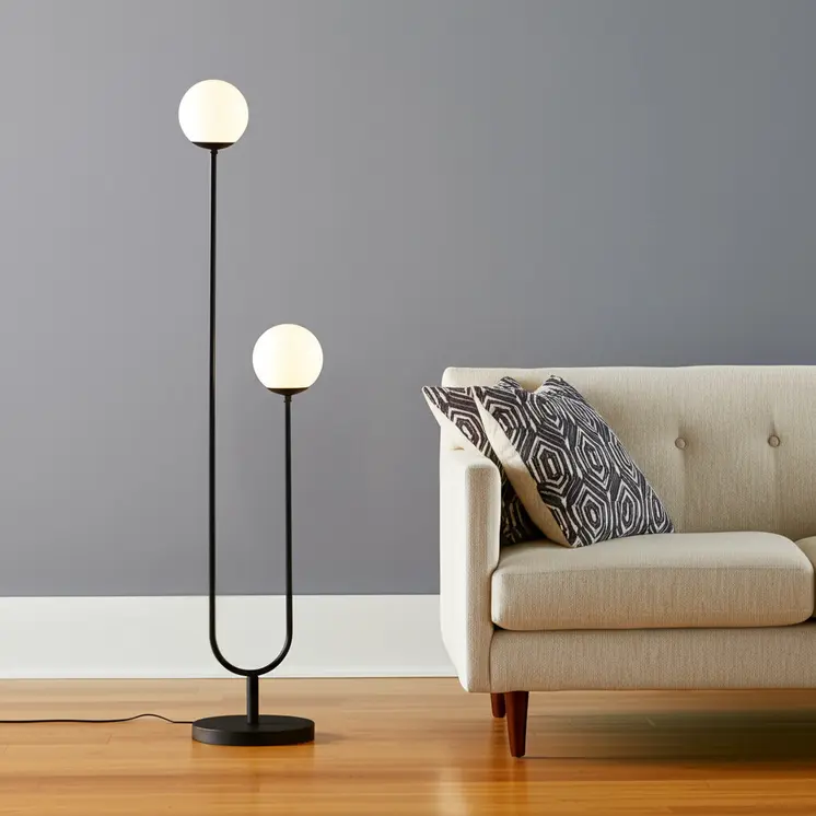 69" Black Two Light Novelty Floor Lamp With White Frosted Glass Globe Shade