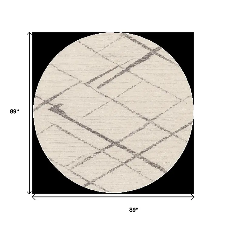 8' Beige and Gray Abstract Distressed Round Rug