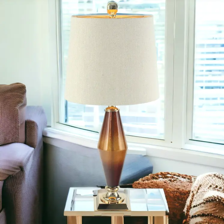 33" Gold and Brown Glass Table Lamp With Beige Cone Shade