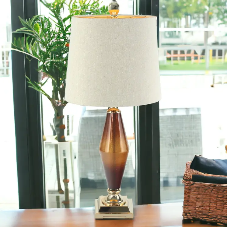 33" Gold and Brown Glass Table Lamp With Beige Cone Shade